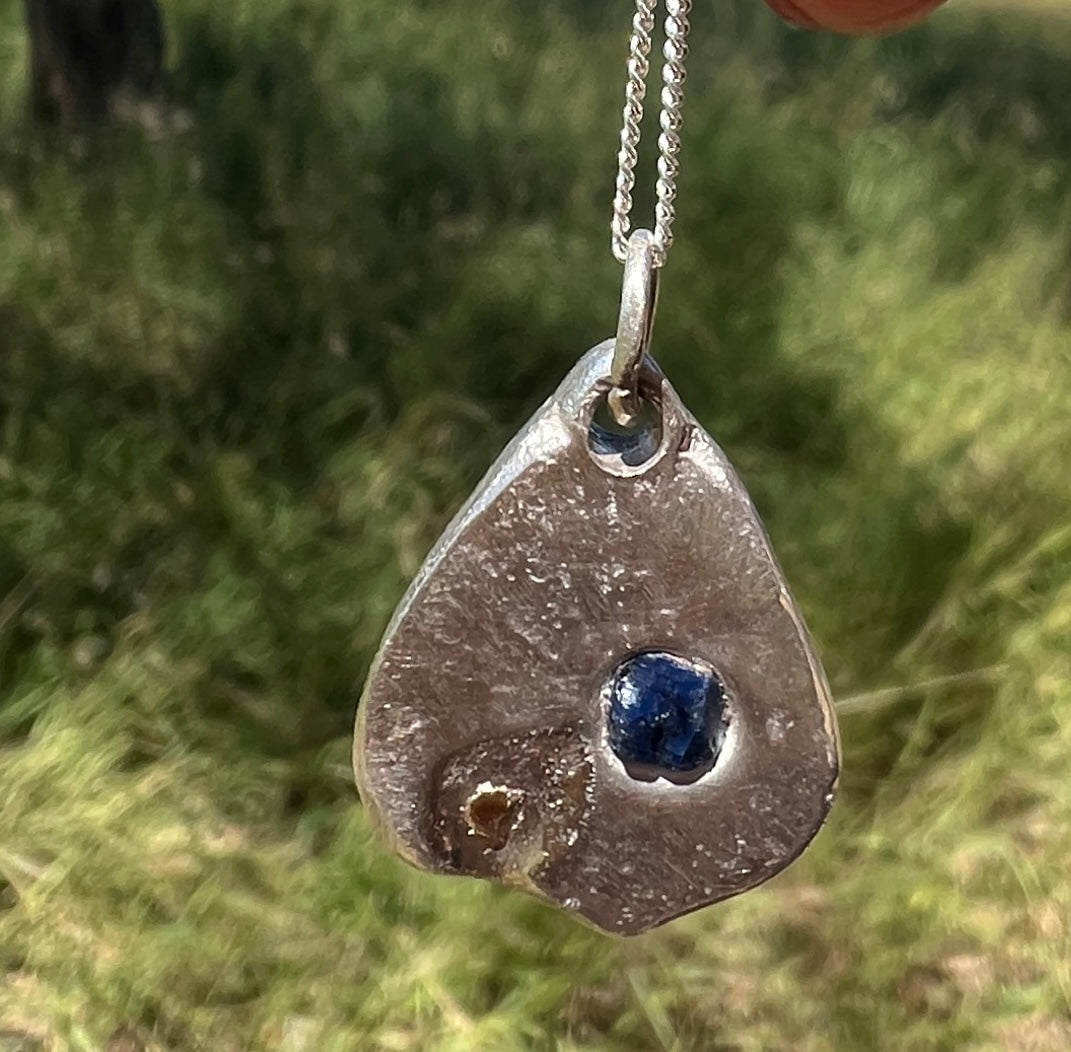 “Lake Bonney” - Pendant Deep blue sapphire with a whisper of gold and Sterling Silver Chain