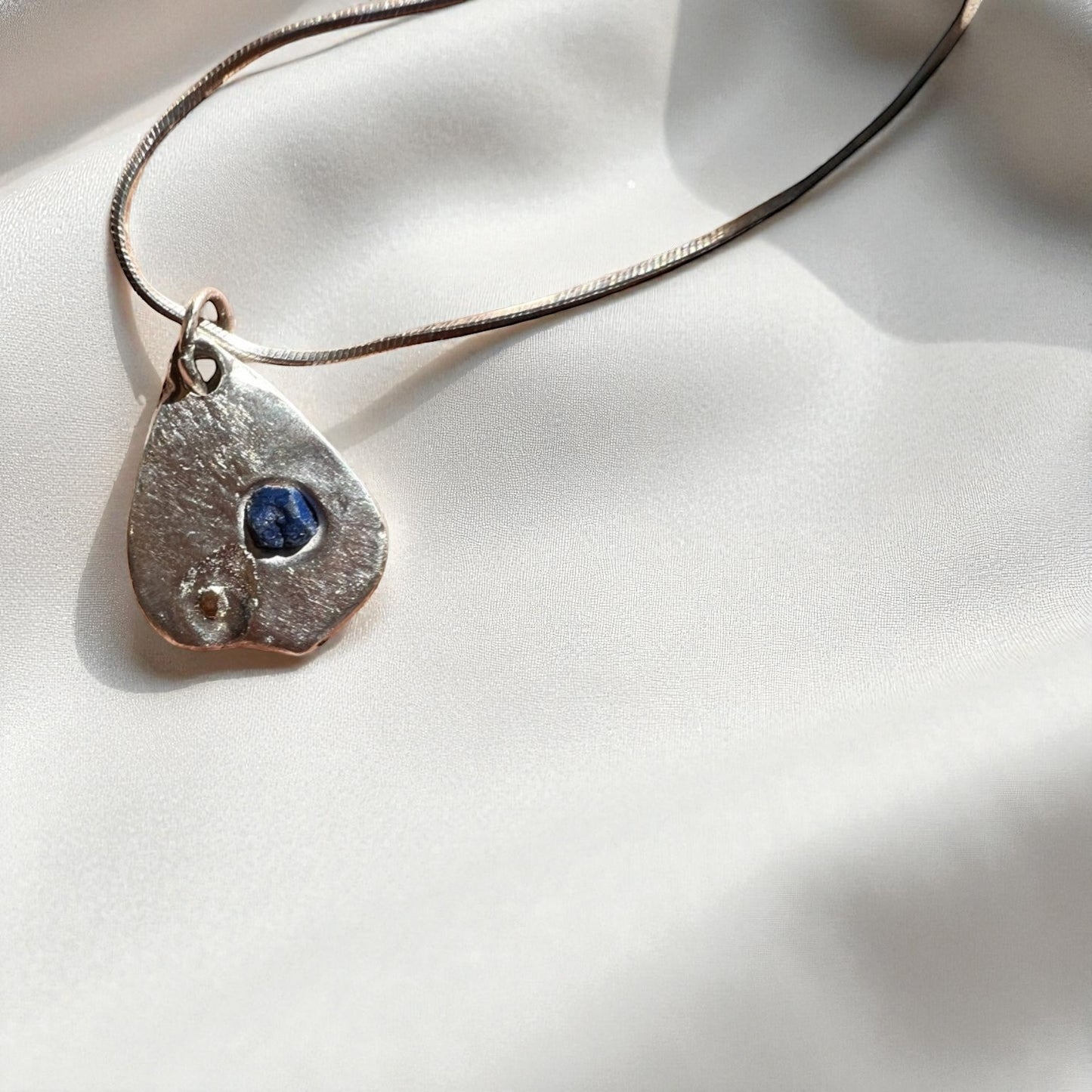 Lake Bonney- Pendant Deep blue sapphire with a whisper of gold and Sterling Silver Chain