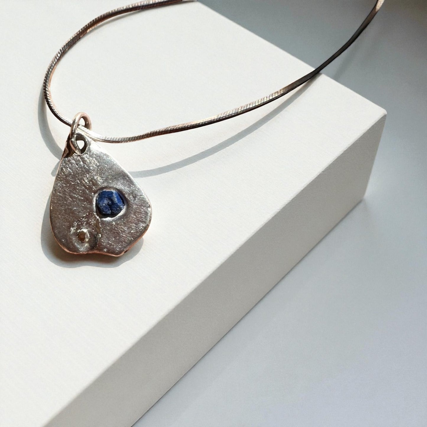 Lake Bonney- Pendant Deep blue sapphire with a whisper of gold and Sterling Silver Chain