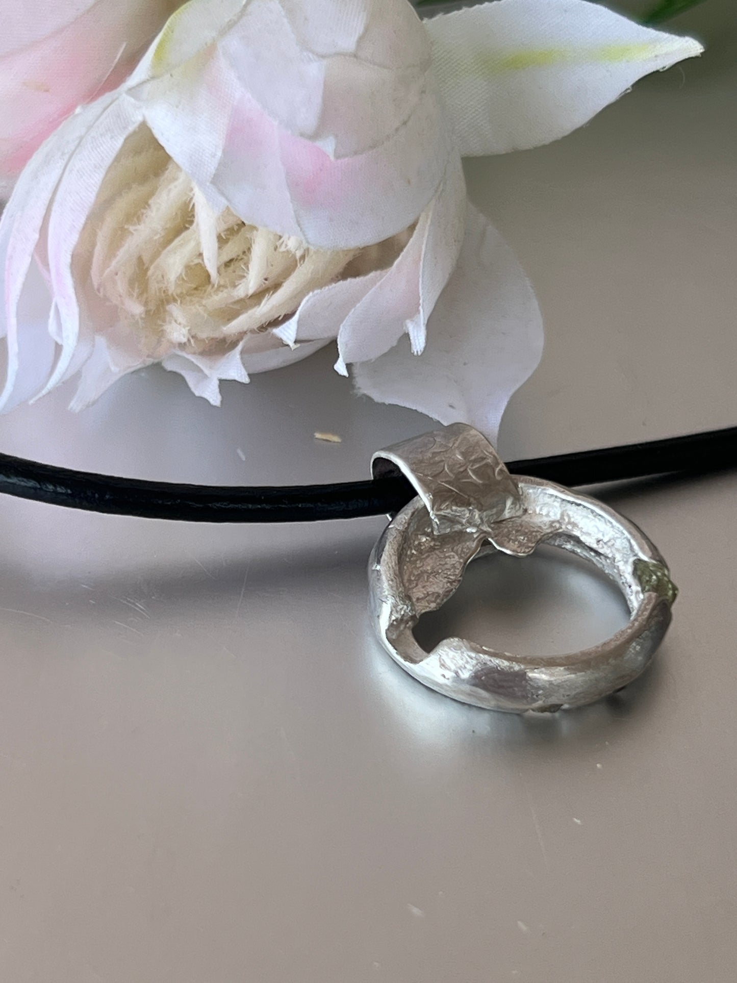“Winton” Sterling Silver Pendant with pale green rough Queensland sapphires.